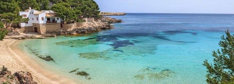 Beach bay azure turquoise sea water hill pine tree, Cala Gat, Majorca island, Spain